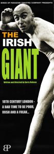 A poster for 'The Irish Giant'  It shows an exceedingly tall man looking around. 