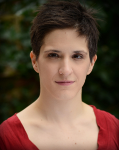 A photo of Amelia Cavallo. She has very short brown hair and brown eyes. 