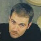 A photo of Ian Halket. He has short brown hair and slender features. 