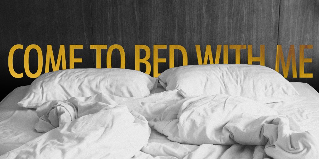 An unmade bed with ruffled cover and pillows, all white. The words "Come to bed with me" are in large yellow capital letters, partially hidden behind the pillows.