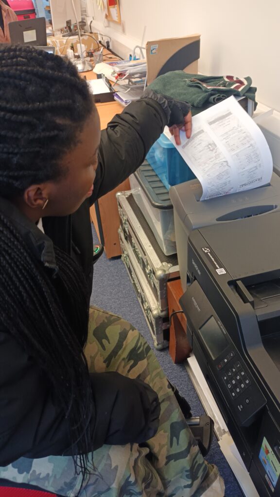 Cleopatra working in the BOP office.